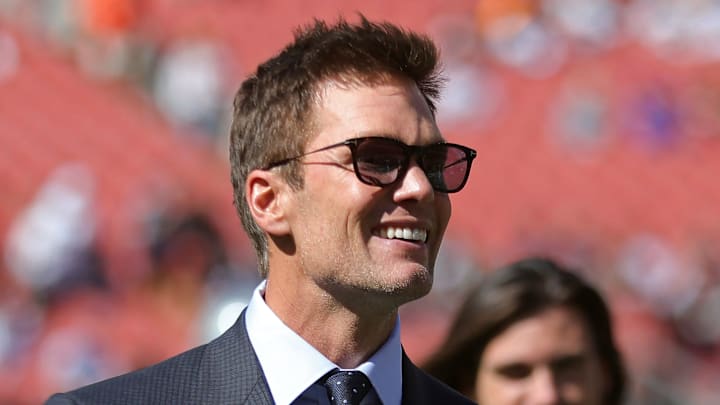 NFL legend Tom Brady is all smiles before an NFL football game at Huntington Bank Field, Sunday, Sept. 8, 2024, in Cleveland, Ohio.