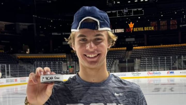 Penn State freshman Gavin McKenna holds the puck from his first collegiate goal at Arizona State on Oct, 3, 2025