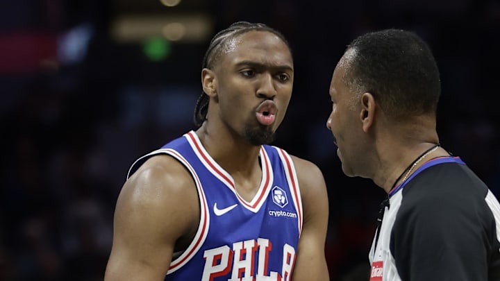 Mar 28, 2026; Charlotte, North Carolina, USA; Philadelphia 76ers guard Tyrese Maxey (0) questions a call with referee James Capers (19) during the third quarter against the Charlotte Hornets at Spectrum Center. Mandatory Credit: Brian Westerholt-Imagn Images