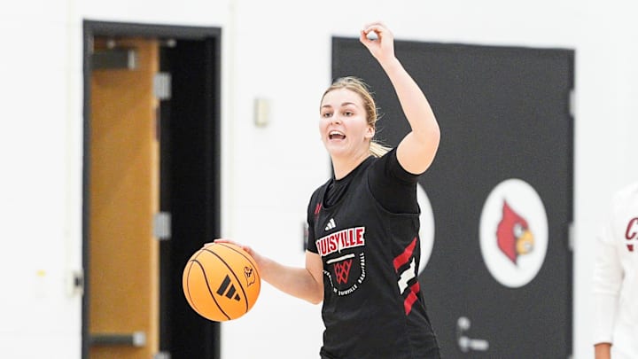 Louisville Cardinals guard Peyton Bradley (20) drives up the court as head coach Jeff Walz watches during the Cards' practice. October 22, 2025.