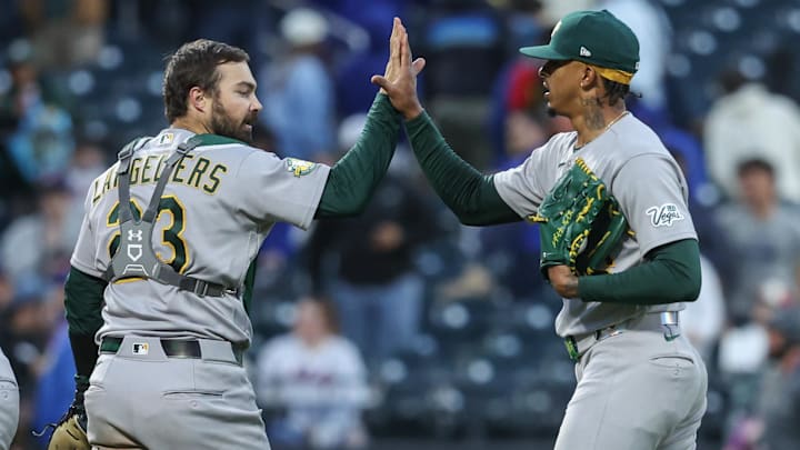 Apr 11, 2026; New York City, New York, USA;  Athletics relief pitcher Luis Medina (46) celebrates with catcher Shea Langeliers (23) after defeating the New York Mets at Citi Field. Mandatory Credit: Wendell Cruz-Imagn Images