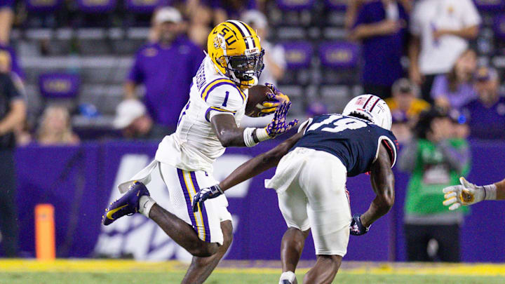 Sep 28, 2024; Baton Rouge, Louisiana, USA;  LSU Tigers wide receiver Aaron Anderson (1) runs against South Alabama Jaguars cornerback Amarion Fortenberry (19) during the second half at Tiger Stadium. Mandatory Credit: Stephen Lew-Imagn Images