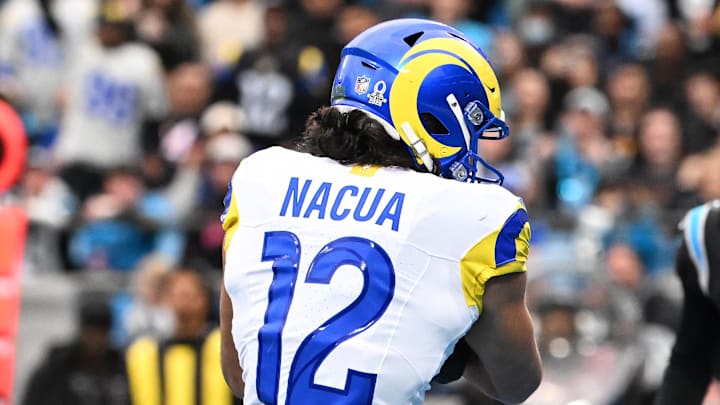 Jan 10, 2026; Charlotte, NC, USA; Los Angeles Rams wide receiver Puka Nacua (12) catches a touchdown against the Carolina Panthers in the first half during the NFC Wild Card Round game at Bank of America Stadium. Mandatory Credit: Bob Donnan-Imagn Images