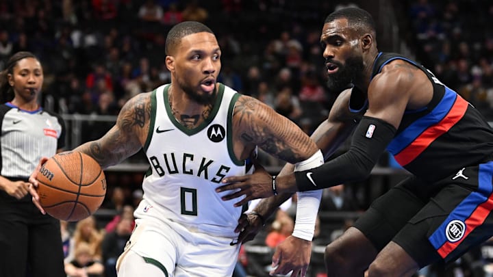 Dec 3, 2024; Detroit, Michigan, USA; Milwaukee Bucks guard Damian Lillard (0) controls the ball against Detroit Pistons forward Tim Hardaway Jr. (8) in the first quarter at Little Caesars Arena. Mandatory Credit: Lon Horwedel-Imagn Images Dec 3, 2024; Detroit, Michigan, USA; Milwaukee Bucks guard Damian Lillard (0) controls the ball against Detroit Pistons forward Tim Hardaway Jr. (8) in the first quarter at Little Caesars Arena. Mandatory Credit: Lon Horwedel-Imagn Images