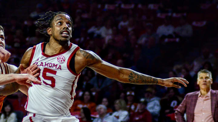 Oklahoma forward Derrion Reid goes for a rebound against Texas.
