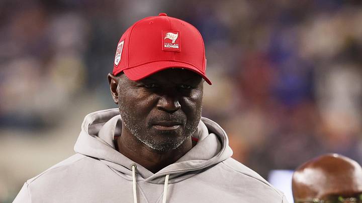 Tampa Bay Buccaneers head coach and defensive coordinator Todd Bowles walks off the field during halftime against the Rams