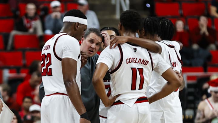 Dec 6, 2025; Raleigh, North Carolina, USA; NC State Wolfpack huddle with head coach Will Wade during the second half of the game against UNC Asheville Bulldogs at Lenovo Center. Mandatory Credit: Jaylynn Nash-Imagn Images