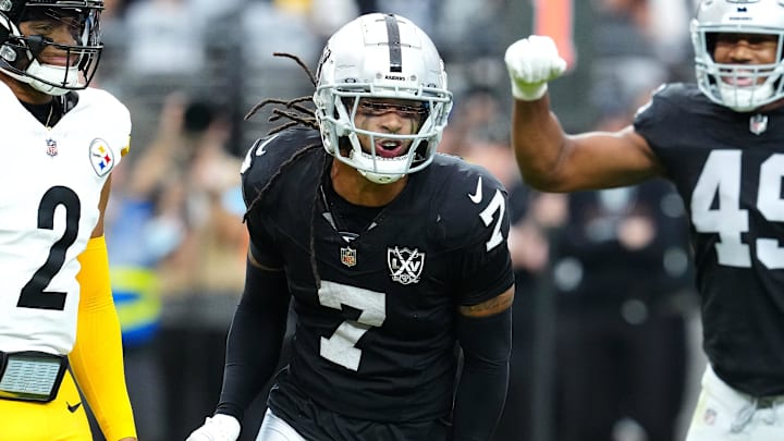 Oct 13, 2024; Paradise, Nevada, USA; Las Vegas Raiders safety Tre'von Moehrig (7) celebrates between Pittsburgh Steelers quarterback Justin Fields (2) and Las Vegas Raiders defensive end Charles Snowden (49) after making a defensive play against the Pittsburgh Steelers during the first quarter at Allegiant Stadium. Mandatory Credit: Stephen R. Sylvanie-Imagn Images Oct 13, 2024; Paradise, Nevada, USA; Las Vegas Raiders safety Tre'von Moehrig (7) celebrates between Pittsburgh Steelers quarterback Justin Fields (2) and Las Vegas Raiders defensive end Charles Snowden (49) after making a defensive play against the Pittsburgh Steelers during the first quarter at Allegiant Stadium. Mandatory Credit: Stephen R. Sylvanie-Imagn Images