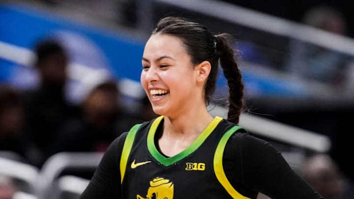 Oregon Ducks guard Ari Long (14) smiles while running to the bench Thursday, March 5, 2026, during a Big Ten women's basketball tournament game at Gainbridge Fieldhouse in Indianapolis. The Oregon Ducks defeated the Maryland Terrapins, 73-68.