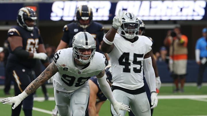 Nov 30, 2025; Inglewood, California, USA; Las Vegas Raiders defensive end Maxx Crosby (98) reacts after a tackle against the Los Angeles Chargers during the second half at SoFi Stadium. Mandatory Credit: Kiyoshi Mio-Imagn Images