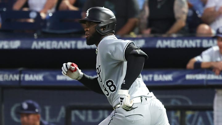 Chicago White Sox outfielder Luis Robert Jr. (88) hits a two-RBI single against the Tampa Bay Rays at George M. Steinbrenner Field. 