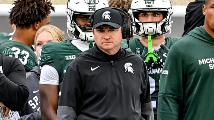 Michigan State's head coach Jonathan Smith, center, looks on from the sideline during the third quarter in the game against UCLA on Saturday, Oct. 11, 2025, at Spartan Stadium in East Lansing. Michigan State's head coach Jonathan Smith, center, looks on from the sideline during the third quarter in the game against UCLA on Saturday, Oct. 11, 2025, at Spartan Stadium in East Lansing.