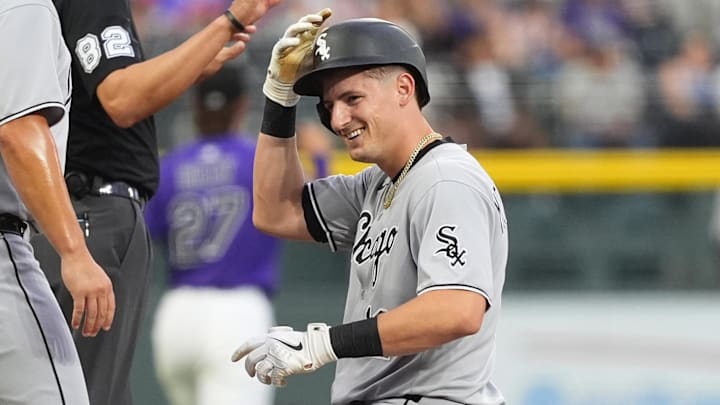 Chicago White Sox shortstop Colson Montgomery (12) smiles after tripling against the Colorado Rockies at Coors Field.