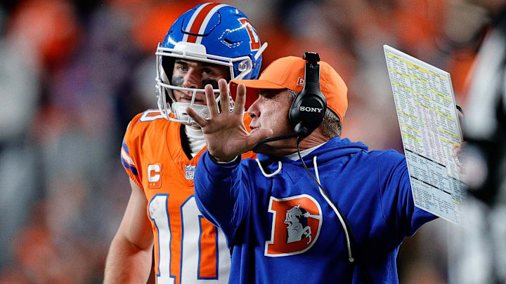 Nov 6, 2025; Denver, Colorado, USA; Denver Broncos quarterback Bo Nix (10) talks with head coach Sean Payton in the fourth quarter against the Las Vegas Raiders at Empower Field at Mile High. 