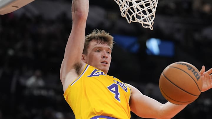 Nov 27, 2024; San Antonio, Texas, USA;  Los Angeles Lakers guard Dalton Knecht (4) dunks in the second half against the San Antonio Spurs at Frost Bank Center. Mandatory Credit: Daniel Dunn-Imagn Images