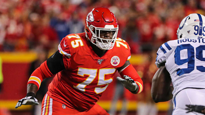 Oct 6, 2019; Kansas City, MO, USA; Kansas City Chiefs tackle Cameron Erving (75) looks to block against Indianapolis Colts defensive end Justin Houston (99) during the first half at Arrowhead Stadium. Mandatory Credit: Jay Biggerstaff-Imagn Images