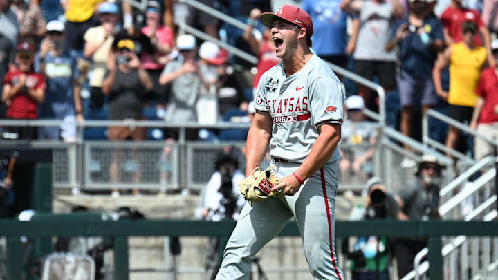 Jun 16, 2025; Omaha, Neb, USA;  Arkansas Razorbacks starting pitcher Gage Wood (14) celebrates completing a no hitter against the Murray State Racers at Charles Schwab Field. 