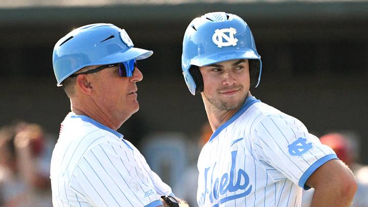 June 7, 2026; Chapel Hill, NC, USA; North Carolina Tar Heels head coach Scott Forbes coaches outfielder Carter French (18) during the ninth inning against the USC Trojans at Boshamer Stadium. Mandatory Credit: Zachary Taft-Imagn Images June 7, 2026; Chapel Hill, NC, USA; North Carolina Tar Heels head coach Scott Forbes coaches outfielder Carter French (18) during the ninth inning against the USC Trojans at Boshamer Stadium. Mandatory Credit: Zachary Taft-Imagn Images