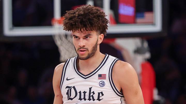 Nov 18, 2025; New York, New York, USA; Duke Blue Devils forward Cameron Boozer (12) reacts against the Kansas Jayhawks during the second half at Madison Square Garden. Mandatory Credit: Vincent Carchietta-Imagn Images