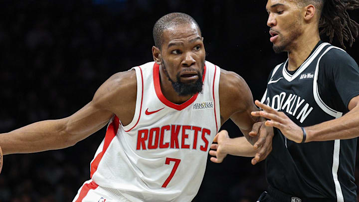 Jan 1, 2026; Brooklyn, New York, USA; Houston Rockets forward Kevin Durant (7) dribbles against Brooklyn Nets forward Ziaire Williams (1) during the second half at Barclays Center. Mandatory Credit: Vincent Carchietta-Imagn Images