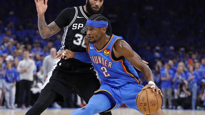 May 30, 2026; Oklahoma City, Oklahoma, USA; Oklahoma City Thunder guard Shai Gilgeous-Alexander (2) controls the ball against San Antonio Spurs forward Julian Champagnie (30) in the fourth quarter during game seven of the western conference finals for the 2026 NBA playoffs at Paycom Center. Mandatory Credit: Alonzo Adams-Imagn Images