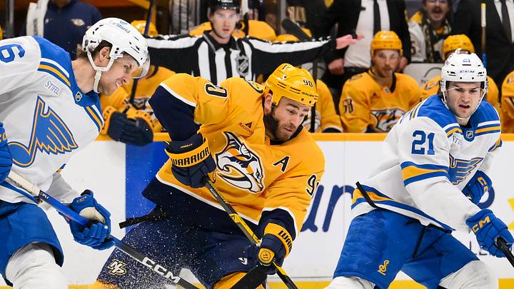 Feb 2, 2026; Nashville, Tennessee, USA; St. Louis Blues defenseman Philip Broberg (6) and Nashville Predators center Ryan O'Reilly (90) battle for the puck during the third period at Bridgestone Arena. Mandatory Credit: Steve Roberts-Imagn Images Feb 2, 2026; Nashville, Tennessee, USA; St. Louis Blues defenseman Philip Broberg (6) and Nashville Predators center Ryan O'Reilly (90) battle for the puck during the third period at Bridgestone Arena. Mandatory Credit: Steve Roberts-Imagn Images