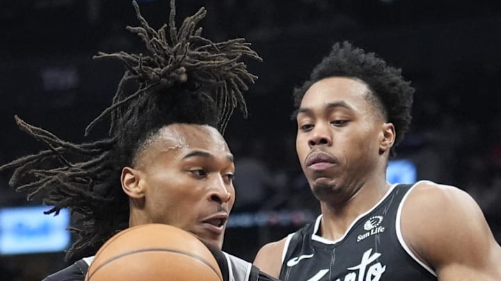 Toronto Raptors guard Scottie Barnes defends against San Antonio Spurs guard Stephon Castle.