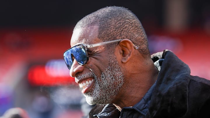 Dec 21, 2025; Cleveland, Ohio, USA;  Legendary  football and baseball player and father of Cleveland Browns quarterback Shedeur Sanders, Deion Sanders on the sidelines prior to a game against the Buffalo Bills at Huntington Bank Field. 