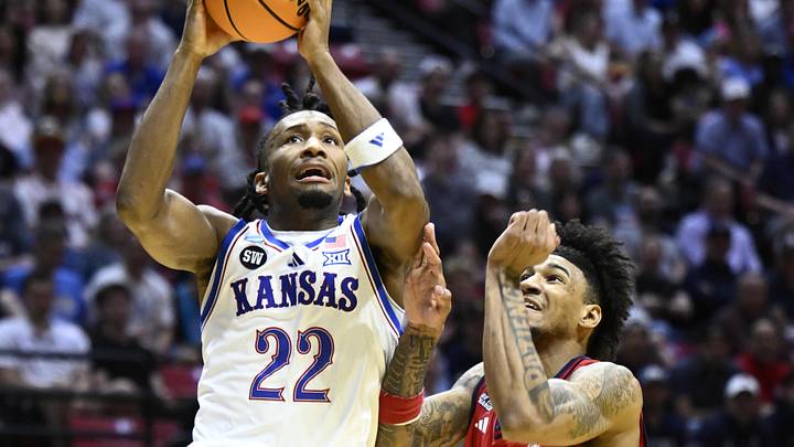 Mar 22, 2026; San Diego, CA, USA; Kansas Jayhawks guard Darryn Peterson (22) shoots against St. John's Red Storm forward Dillon Mitchell (1) in the first half during a second round game of the men's 2026 NCAA Tournament at Viejas Arena. Mandatory Credit: Denis Poroy-Imagn Images