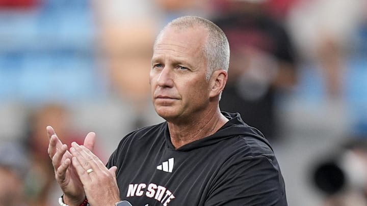 Sep 7, 2024; Charlotte, North Carolina, USA; North Carolina State Wolfpack head coach Dave Doeren during pregame activities against the Tennessee Volunteers at the Dukes Mayo Classic at Bank of America Stadium. Mandatory Credit: Jim Dedmon-Imagn Images