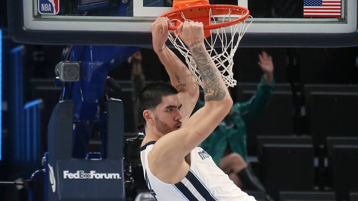 Oct 16, 2026; Memphis, Tennessee, USA;  Memphis Grizzlies center Zach Edey (14) dunks during the third quarter against the Charlotte Hornets at FedExForum.  Mandatory Credit: Petre Thomas-Imagn Images