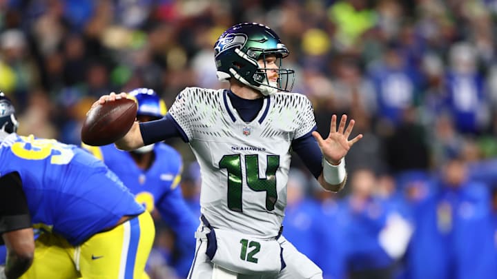 Dec 18, 2025; Seattle, Washington, USA; Seattle Seahawks quarterback Sam Darnold (14) throws a pass against the Los Angeles Rams in the second half at Lumen Field.