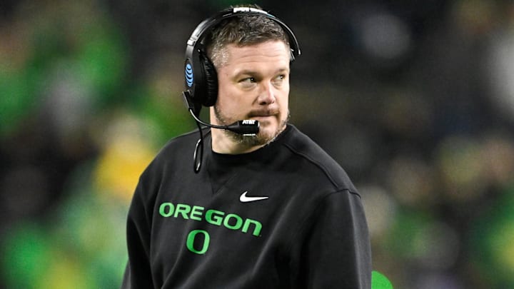 Dec 20, 2025; Eugene, OR, USA;  Oregon Ducks head coach Dan Lanning looks on during the fourth quarter against the James Madison Dukes at Autzen Stadium. Mandatory Credit: Craig Strobeck-Imagn Images