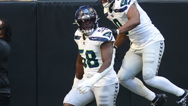 Oct 20, 2024; Atlanta, Georgia, USA; Seattle Seahawks linebacker Derick Hall (58) celebrates after a touchdown with linebacker Tyrel Dodson (0) against the Atlanta Falcons in the fourth quarter at Mercedes-Benz Stadium. Mandatory Credit: Brett Davis-Imagn Images Oct 20, 2024; Atlanta, Georgia, USA; Seattle Seahawks linebacker Derick Hall (58) celebrates after a touchdown with linebacker Tyrel Dodson (0) against the Atlanta Falcons in the fourth quarter at Mercedes-Benz Stadium. Mandatory Credit: Brett Davis-Imagn Images