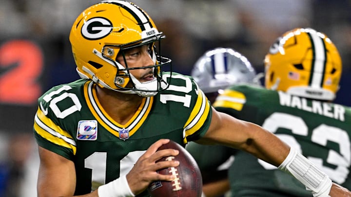 Green Bay Packers quarterback Jordan Love (10) rolls out of the pocket against the Cowboys. Green Bay Packers quarterback Jordan Love (10) rolls out of the pocket against the Cowboys.