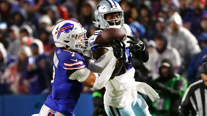 Buffalo Bills cornerback Taron Johnson (7) breaks up a pass intended for Dallas Cowboys wide receiver CeeDee Lamb (88).