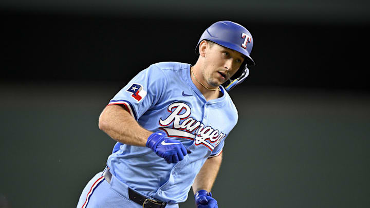 Texas Rangers left fielder Wyatt Langford rounds the bases.