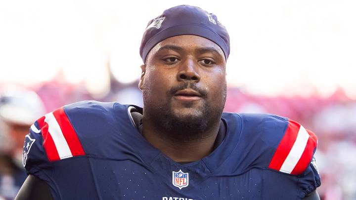 Dec 15, 2024; Glendale, Arizona, USA; New England Patriots defensive tackle Christian Barmore (90) against the Arizona Cardinals at State Farm Stadium. Mandatory Credit: Mark J. Rebilas-Imagn Images