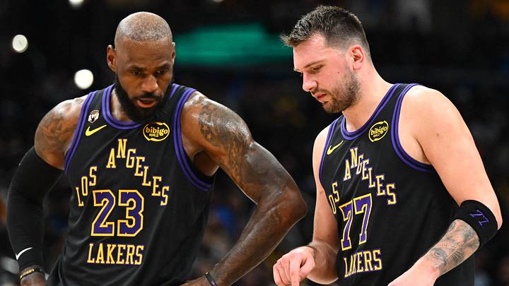 Jan 30, 2026; Washington, District of Columbia, USA; Los Angeles Lakers forward/guard Luka Doncic (77) talks with Los Angeles Lakers forward LeBron James (23) against the Washington Wizards during the second half at Capital One Arena. Mandatory Credit: Brad Mills-Imagn Images