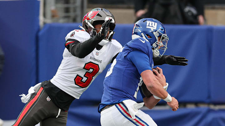 New York Giants quarterback Tommy DeVito (15) is tackled by Tampa Bay Buccaneers safety Jordan Whitehead (3) during the second half. New York Giants quarterback Tommy DeVito (15) is tackled by Tampa Bay Buccaneers safety Jordan Whitehead (3) during the second half.