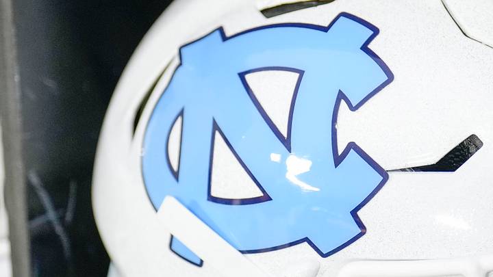 Dec 27, 2023; Charlotte, NC, USA; North Carolina Tar Heels white helmet during pregame warm ups against the West Virginia Mountaineers at Bank of America Stadium. Mandatory Credit: Jim Dedmon-USA TODAY Sports Dec 27, 2023; Charlotte, NC, USA; North Carolina Tar Heels white helmet during pregame warm ups against the West Virginia Mountaineers at Bank of America Stadium. Mandatory Credit: Jim Dedmon-USA TODAY Sports