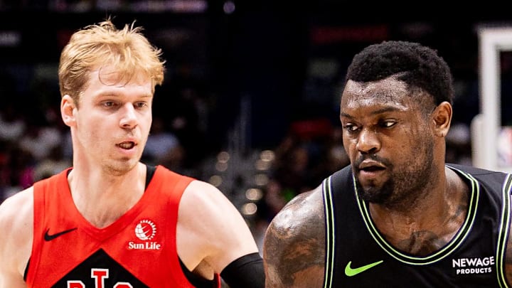 New Orleans Pelicans forward Zion Williamson dribbles against Toronto Raptors guard/forward Gradey Dick.