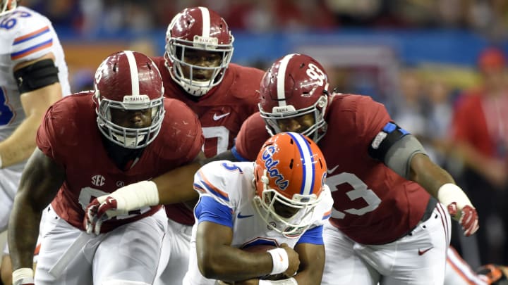 Dec 5, 2015; Atlanta, GA, USA; Florida Gators quarterback Treon Harris (3) is sacked by Alabama Crimson Tide defensive lineman Jonathan Allen (93) and teammates during the second quarter of the 2015 SEC Championship Game at the Georgia Dome. 