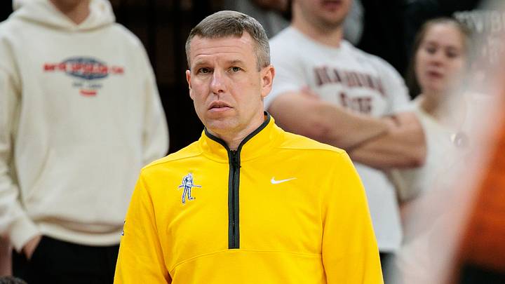 Feb 24, 2026; Stillwater, Oklahoma, USA; West Virginia Mountaineers coach Ross Hodge watches game play during the first half against the Oklahoma State Cowboys at Gallagher-Iba Arena. Mandatory Credit: William Purnell-Imagn Images Feb 24, 2026; Stillwater, Oklahoma, USA; West Virginia Mountaineers coach Ross Hodge watches game play during the first half against the Oklahoma State Cowboys at Gallagher-Iba Arena. Mandatory Credit: William Purnell-Imagn Images