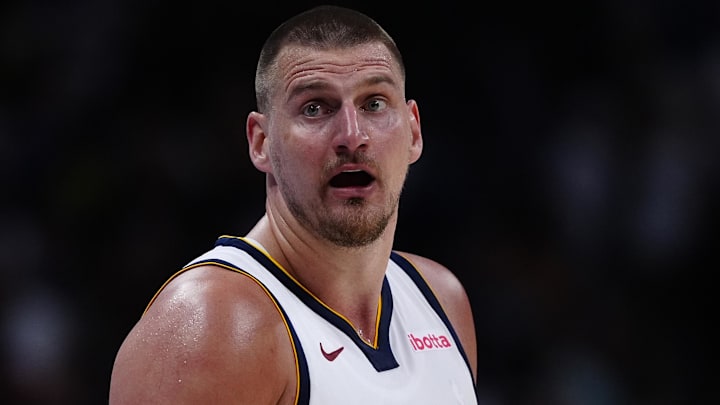 Apr 11, 2025; Denver, Colorado, USA; Denver Nuggets center Nikola Jokic (15) reacts in the fourth quarter against the Memphis Grizzlies at Ball Arena. Mandatory Credit: Ron Chenoy-Imagn Images