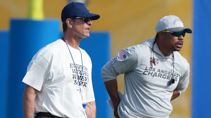 Los Angeles Chargers coach Jim Harbaugh (left) and passing game coordinator Marcus Brady during training camp. Los Angeles Chargers coach Jim Harbaugh (left) and passing game coordinator Marcus Brady during training camp.