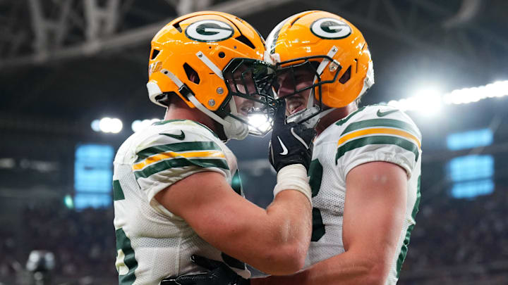Oct 19, 2025; Glendale, Arizona, USA; Green Bay Packers tight end Tucker Kraft (85) celebrates a touchdown against the Arizona Cardinals with Green Bay Packers tight end Luke Musgrave (88) during the second half against the Arizona Cardinals at State Farm Stadium. Mandatory Credit: Joe Camporeale-Imagn Images