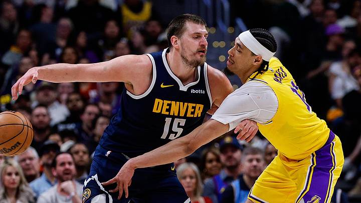 Mar 5, 2026; Denver, Colorado, USA; Los Angeles Lakers center Jaxson Hayes (11) knocks the ball away from Denver Nuggets center Nikola Jokic (15) in the fourth quarter at Ball Arena.