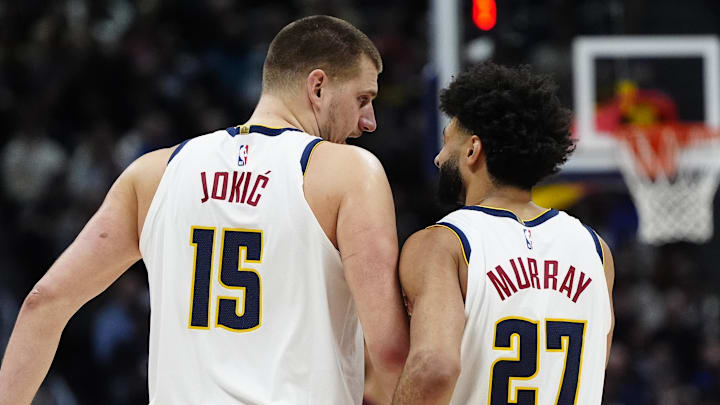 Jan 1, 2025; Denver, Colorado, USA; Denver Nuggets center Nikola Jokic (15) and guard Jamal Murray (27) talk in the third quarter against the Atlanta Hawks at Ball Arena. Mandatory Credit: Ron Chenoy-Imagn Images Jan 1, 2025; Denver, Colorado, USA; Denver Nuggets center Nikola Jokic (15) and guard Jamal Murray (27) talk in the third quarter against the Atlanta Hawks at Ball Arena. Mandatory Credit: Ron Chenoy-Imagn Images