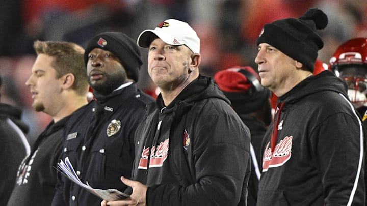 Nov 23, 2024; Louisville, Kentucky, USA; Louisville Cardinals head coach Jeff Brohm looks toward the scoreboard during the second half against the Pittsburgh Panthers at L&N Federal Credit Union Stadium. Louisville defeated Pittsburgh 37-9. Nov 23, 2024; Louisville, Kentucky, USA; Louisville Cardinals head coach Jeff Brohm looks toward the scoreboard during the second half against the Pittsburgh Panthers at L&N Federal Credit Union Stadium. Louisville defeated Pittsburgh 37-9.